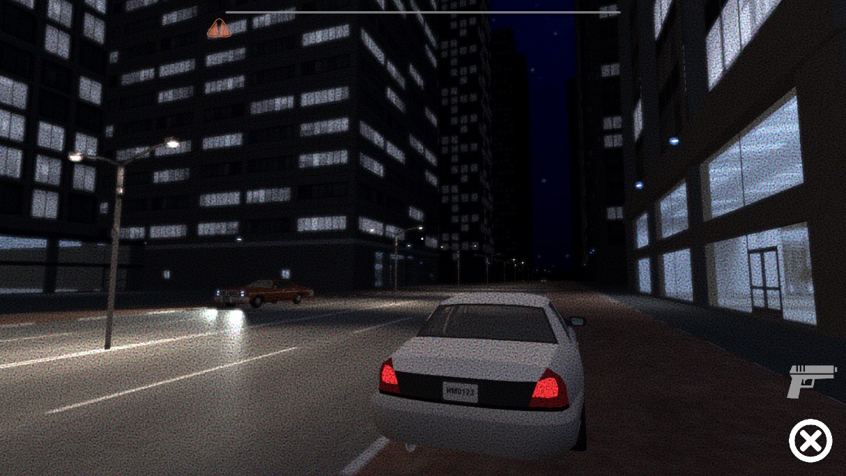 City street at night, white sedan and tall dark buildings